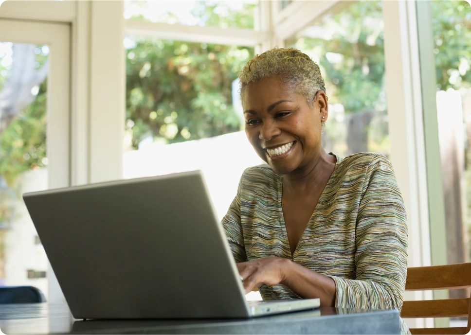 Cheerful individual typing at desk